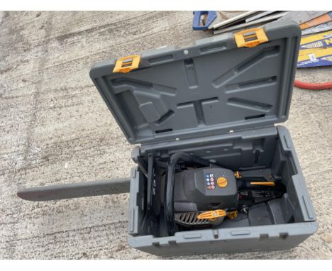 A RYOBI PETROL CHAINSAW WITH CARRY CASE 