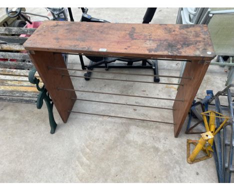 A VINTAGE WOODEN SHOE RACK 