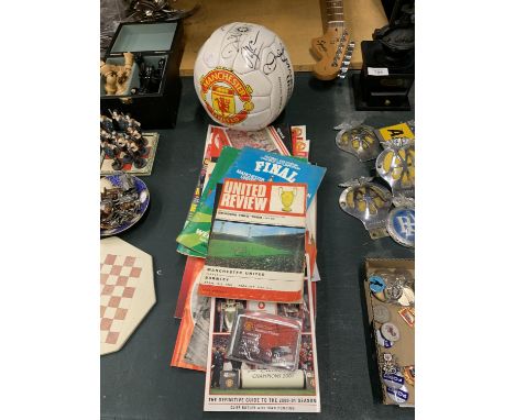 A COLLECTION OF VINTAGE MANCHESTER UNITED PROGRAMMES PLUS A SIGNED BALL 