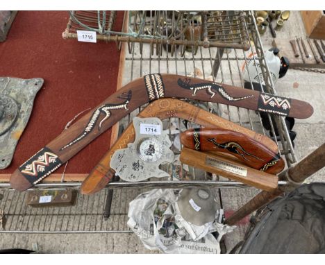 THREE WOODEN BOOMERANGS AND A CLOCK SET IN A MAP OF AUSTRALIA 