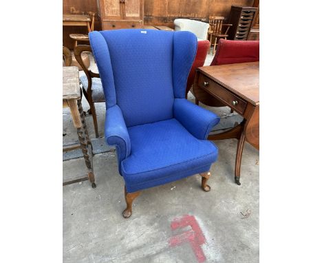 A PARKER KNOLL WINGED FIRESIDE CHAIR MODEL NO. PK. 720/2 
