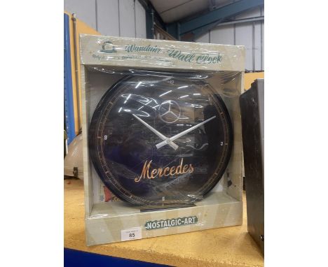 A NEW AND BOXED MERCEDES WALL CLOCK 