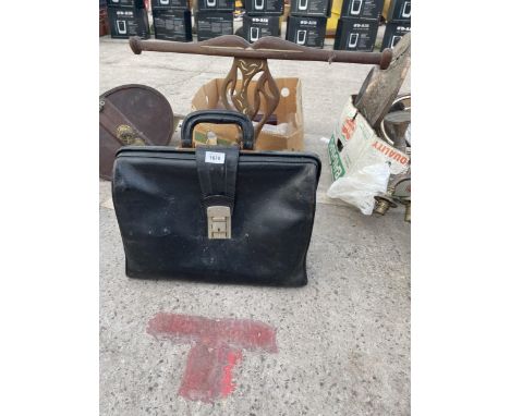A VINTAGE LEATHER BRIEFCASE AND A TREEN CARVED FIGURE 
