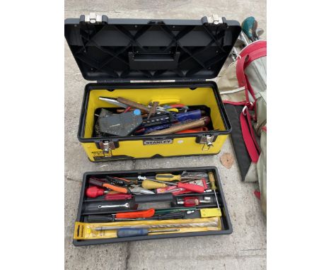 A STANLEY TOOL BOX WITH AN ASSORTMENT OF TOOLS TO INCLUDE AN AXE, SCREW DRIVERS AND PLIERS ETC 