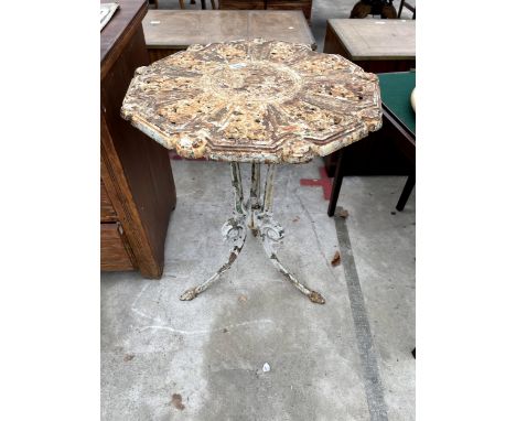 A CAST IRON PUB/PATIO TABLE WITH PIERCED TOP AND TRIPOD BASE 