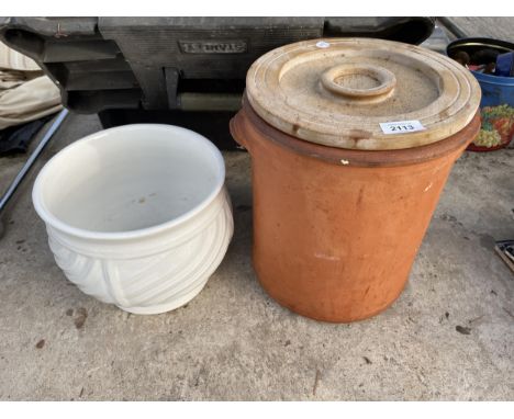A TERRACOTTA LIDDED POT AND A FURTHER CERAMIC PLANTER 