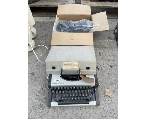 AN AEG OLYMPIA TRAVELLER DELUXE S TYPEWRITER 