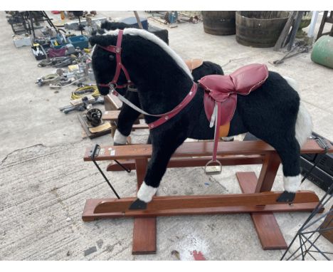 A VINTAGE PEGASUS BLACK AND WHITE ROCKING HORSE 