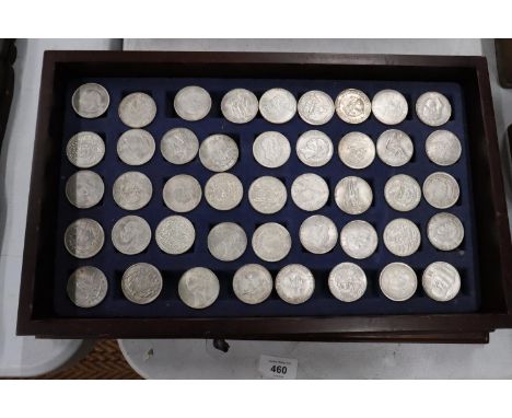 FORTY FOUR VARIOUS VINTAGE TOKENS/COINS IN A WOODEN BOX