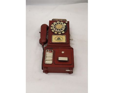 AN UNUSUAL USA VINTAGE TIN PLATE PHONE MONEY BOX, HEIGHT 33CM 