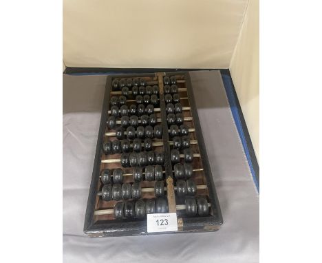 A VINTAGE WOOD AND BRASS ABACUS 