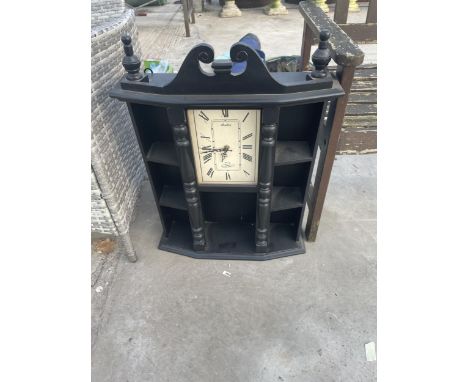 A WOODEN MULTISECTION WALL SHELF WITH AVALON CLOCK 