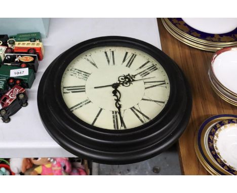A MODERN STYLE CLOCK WITH ROMAN NUMERALS 