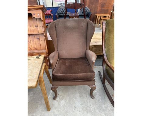 A PARKER KNOLL WINGED FIRESIDE CHAIR ON CABRIOLE FRONT LEGS MODEL NO. PK.918-19 