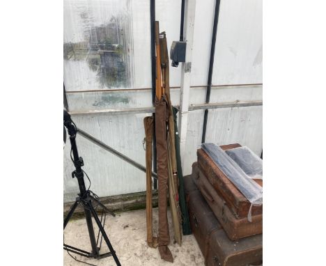 AN ASSORTMENT OF VINTAGE FISHING RODS WITH CARRY BAGS 