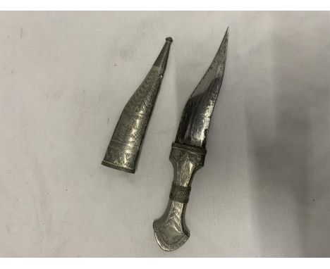 AN ASIAN WHITE METAL DAGGER IN A SHEATH 