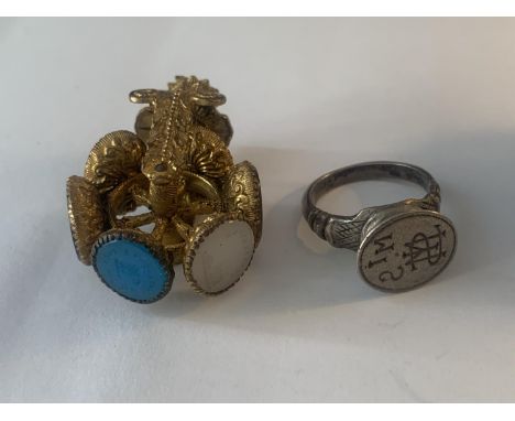 TWO VINTAGE WAX SEALS ONE A SPINNING WHEEL WITH SIX INDIVIDUAL MATRICES EACH ONE SHOWING A DIFFERENT SENTIMENT AND PICTURE 