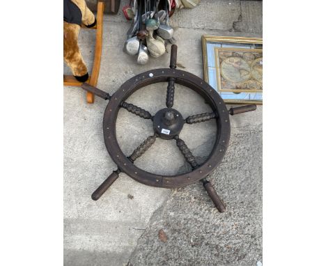 A VINTAGE DECORATIVE WOODEN SHIPS WHEEL 