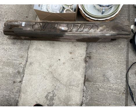 A VINTAGE WOODEN MANTLE PIECE CARVED 'WH 1717' 