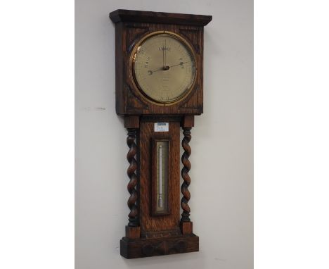 Early 20th century oak barley twist cased aneroid barometer with mercury thermometer, signed 'J.C McKechnie 5 Castle St. Edin