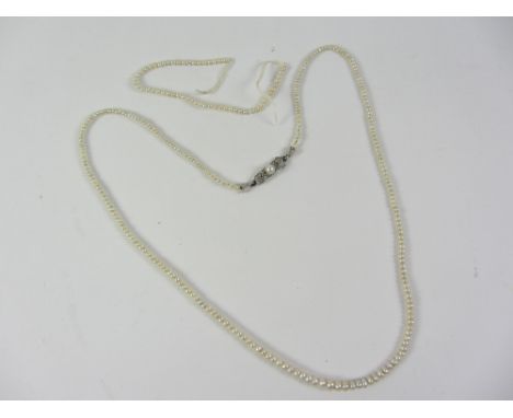 Natural graduating pearl necklace and spare pearls Condition Report Click here for further images, condition, auction times &