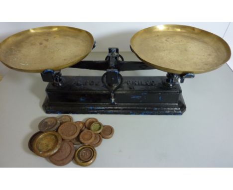 Set of early 20th century 'Force' cast iron scales with brass pans, with weights  Condition Report Click here for further ima