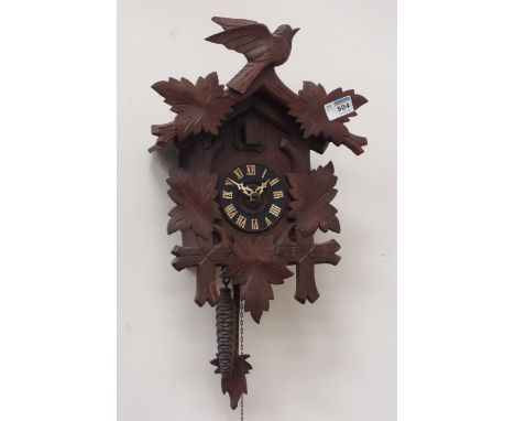 20th century carved wood cased cuckoo clock  CLOCKS & BAROMETERS - as we are not a retailer, these items are sold as seen and