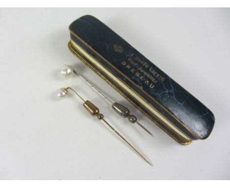 Natural pearl platinum stick pin and one other stamped 585, retailed Raimondo Lorenzi Hof-Juwelier Breslau, original box Cond