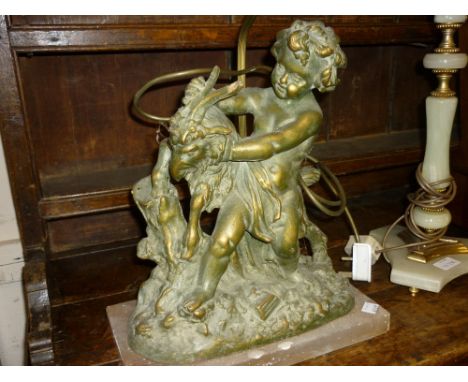 Gilded plaster table lamp in the form of putto with a goat together with an onyx table lamp