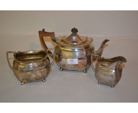 Silver three piece tea service of irregular octagonal baluster form with gadroon rims above a reeded band embossed with acant