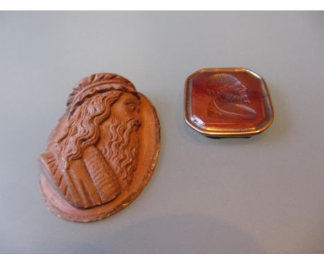 Cornelian and yellow metal intaglio seal and a lava cameo, carved with a portrait in profile