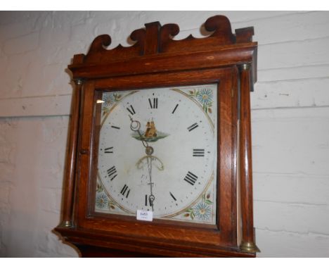 Small George III oak longcase clock with a square hood above rectangular panelled door on a plinth base, the enamel dial pain