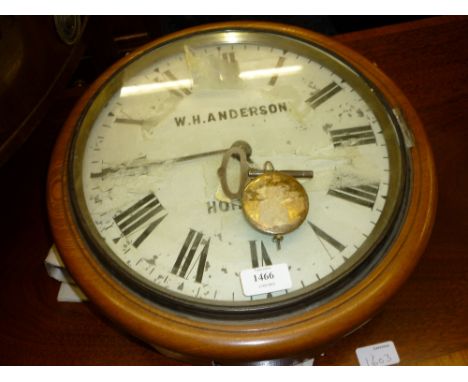 Early 20th Century circular light oak cased wall clock, the painted dial with Roman numerals and single train movement, signe