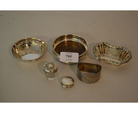 Two silver trinket dishes, a silver coaster, silver and glass pot, a napkin ring and a pill box