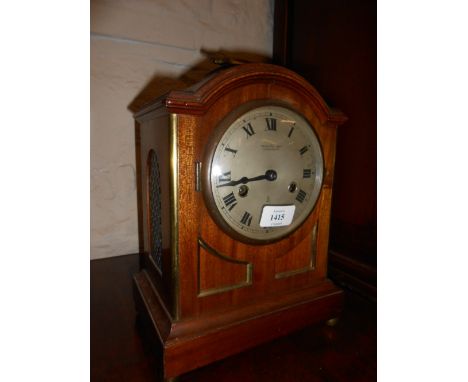 Early 20th Century mahogany and brass mounted bracket clock in Regency style, the silvered dial with Roman numerals, signed P