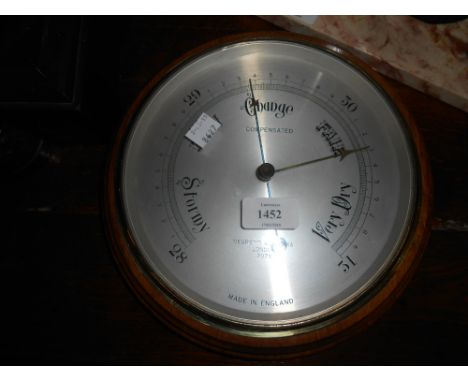 Negretti and Zambra circular mahogany cased aneroid barometer