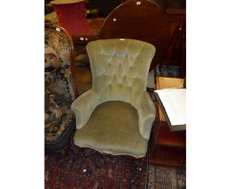19th Century green button upholstered elbow chair raised on carved walnut cabriole front supports