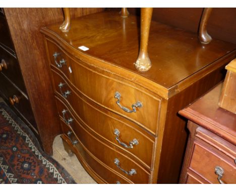 Reproduction mahogany serpentine fronted chest of four long drawers, raised on bracket feet