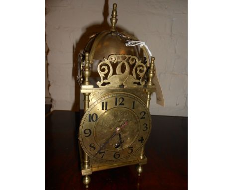 Early 20th Century brass lantern clock having engraved dial with brass chapter ring and Arabic numerals with single train eig