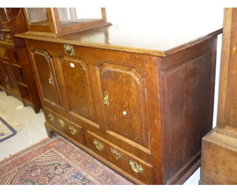 Mid 18th Century oak mule chest, the hinged moulded cover above three fielded panels (two adapted for use as doors) and two d