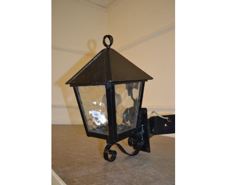 Black painted wrought iron lantern form exterior wall light