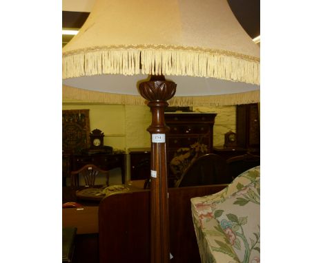 20th Century mahogany standard lamp having tapering reeded and carved column on three C-scroll shaped supports (including sha