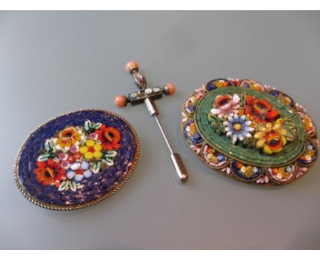 Two micro mosaic floral decorated brooches and a micro mosaic stick pin