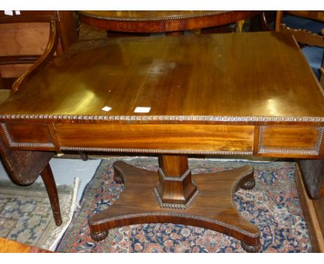 William IV rosewood drop-leaf sofa table with a frieze drawer raised on hexagonal column and platform base with bun feet