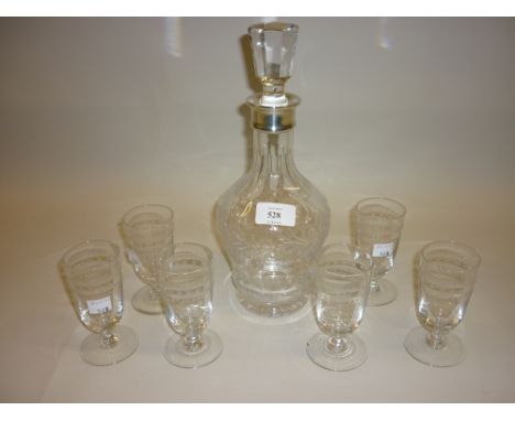 20th Century cut glass decanter with silver collar together with a set of six early 20th Century etched drinking glasses