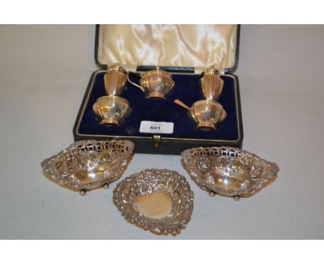 Cased five piece silver condiment set together with three small silver embossed and pierced trinket dishes