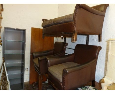 Early 20th Century brown leather upholstered two seater sofa together with two matching armchairs upholstered in brown rexine