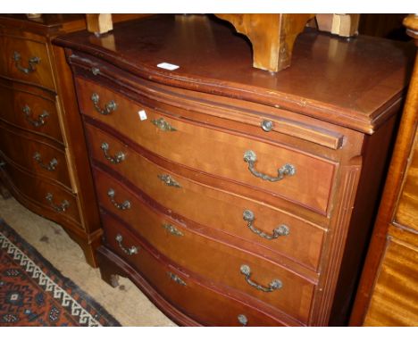 Reproduction mahogany serpentine fronted chest with brushing slide over drawers raised on bracket feet