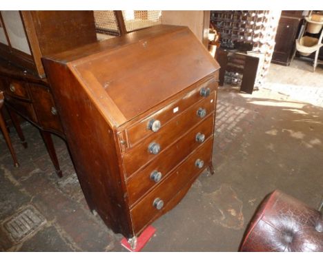 George III pine bureau, the fall front enclosing a fitted interior above four graduated drawers with knob handles and splay b