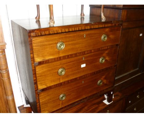George III mahogany chest of three long graduated drawers with circular brass ring handles raised on bracket feet